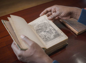 Jonathan Michael Square browses Uncle Tom's Cabin
