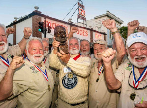 Tim Stockwell of Key West, Florida, celebrates his victory with a group of past winners