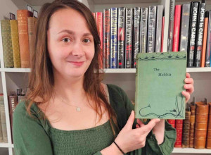 Auctioneum book specialist Caitlin Riley with the copy of The Hobbit