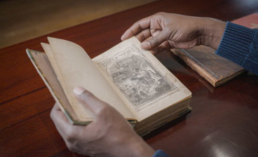 Jonathan Michael Square browses Uncle Tom's Cabin