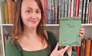 Auctioneum book specialist Caitlin Riley with the copy of The Hobbit