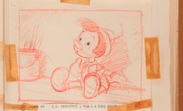 Sketch of Disney's Pinocchio in red, mounted with tape to a sketchbook page.