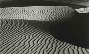Edward Weston, (1886–1958), Wind Erosion, Dunes at Oceano, 1936, gelatin silver print, mounted on card, likely printed 1940s. Estimate: $150,000-$250,000.