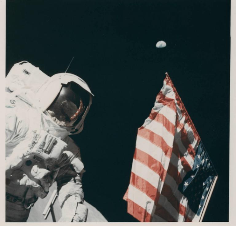  Harrison Schmitt, the Earth and the US flag, Eugene Cernan [Apollo 17], 7-19 December 1972