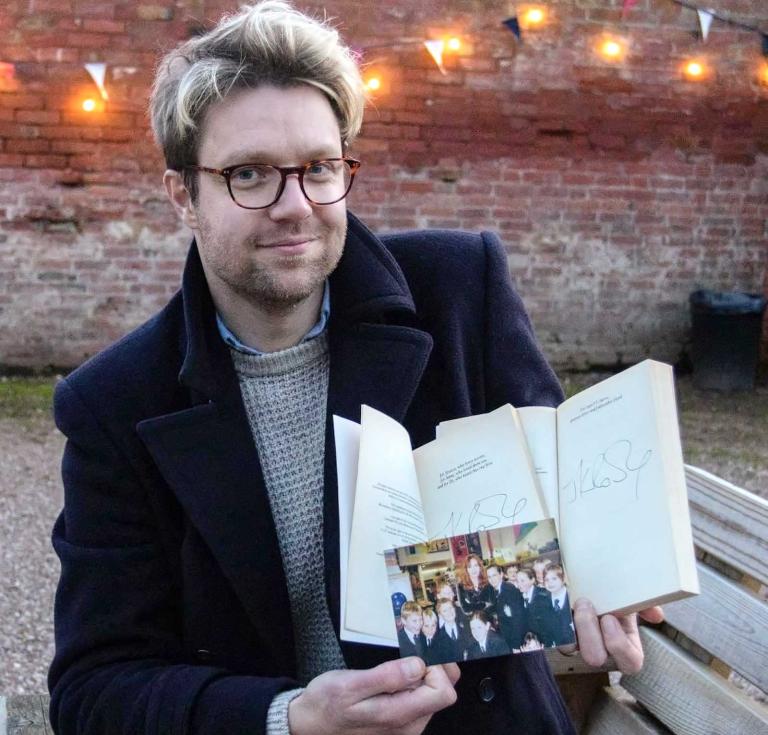 Books expert Jim Spencer with the lot set for auction