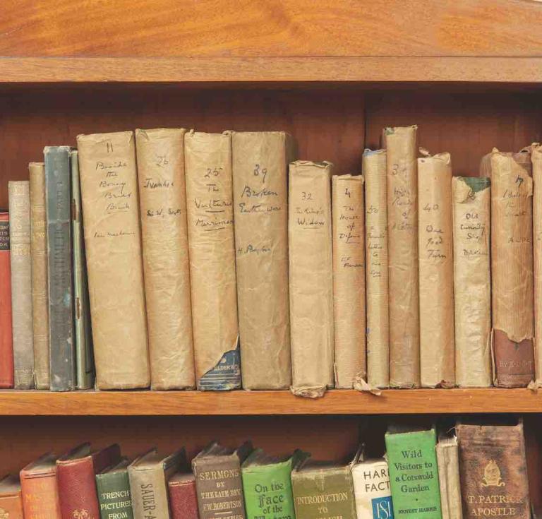Part of the library at Springhill with books covered in brown paper for American troops housed there in the Second World War