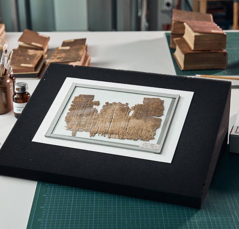 The oldest known book fragment in the world to date was recognized by conservators at the University of Graz by a thread remnant, sewing holes, the centerfold and the text arranged in columns. 