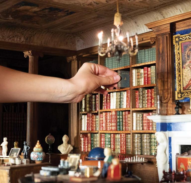 stamp-sized books in the library of Queen Mary’s Dolls’ House