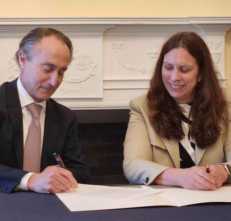 Howard Hochhauser, Chief Financial Officer and Chief Operating Officer at Ancestry, signs an official agreement with Dr. Colleen Shogan, Archivist of the United States, at a signing event at the National Archives Building