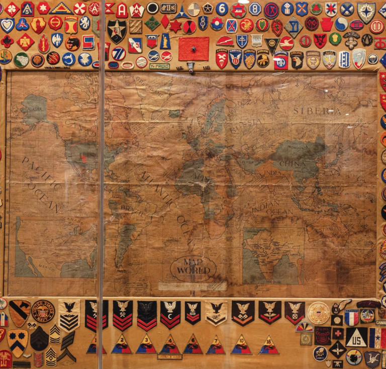 This map was used in the Union Depot train station in El Paso, Texas, and has signatures and unit patches from soldiers who passed through. It’s now on view at the National WWII Museum in New Orleans.